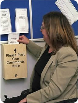 Lady posting feedback into a comments box