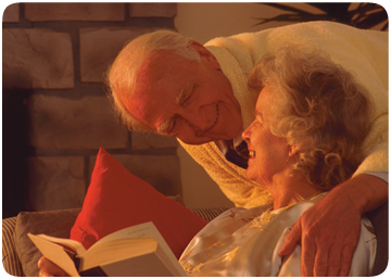 Eldery couple reading a book