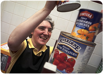 Lady stacking tins